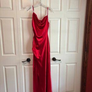 A red satin dress that reached the floor